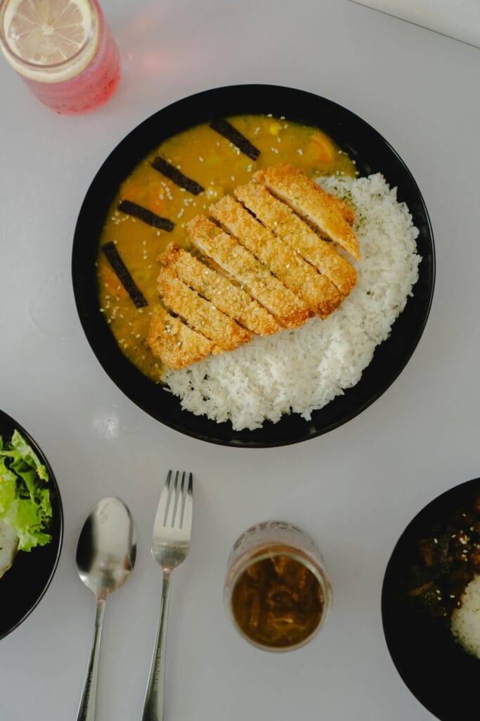 Top view of a Japanese katsu curry dish served with rice in Madiun, Indonesia.