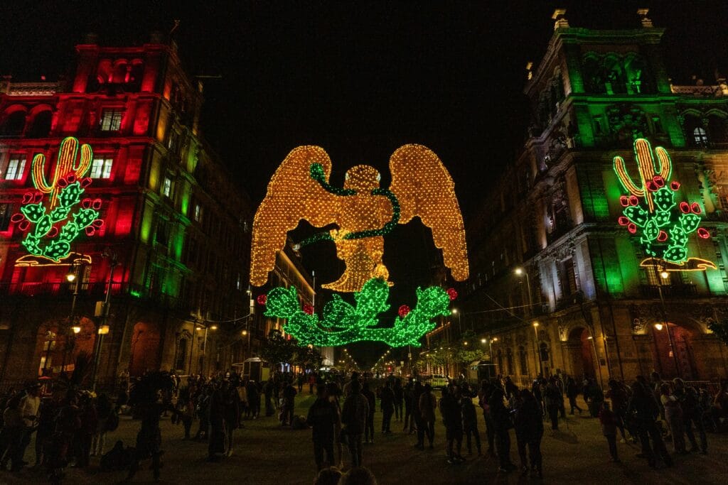 Nighttime scene of vibrant LED display celebrating Mexico's Independence in Zocalo, CDMX.